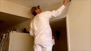 Cut or trim a wall into a ceiling.