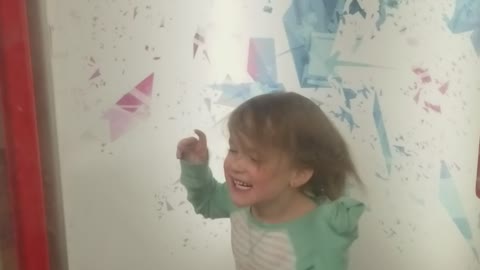 Daughter loving the hurricane machine at a local playhouse