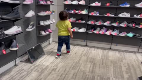 Kid Choosing Shoes For His Mom