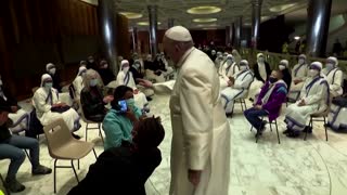 Pope meets homeless getting free COVID vaccines