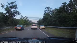 Car Stops Highway Traffic After Spinning Out of Control