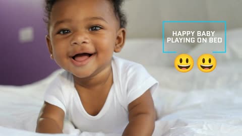 happy baby play on bed