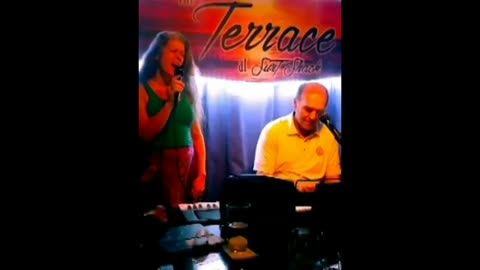 Barbara singing with Eddie Tobin at the St. Armand's piano bar 2019.