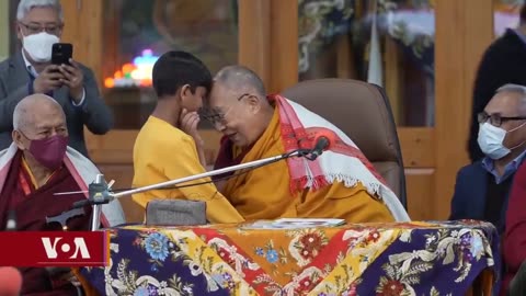 Dalai Lama kissed an Indian boy at a Buddhist event