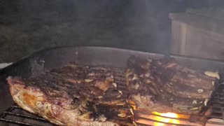 Pork Ribs Sizzling On The Grill