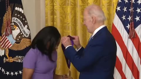 Biden handing out participation trophies & sniffing hair