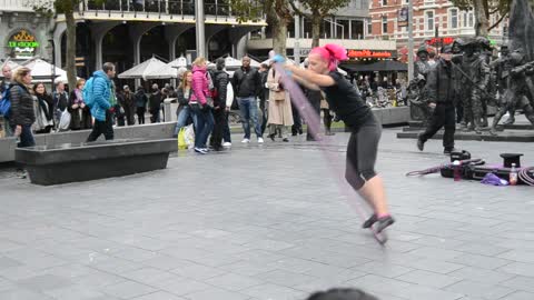 Street performer moves in a big ring in Amsterdam