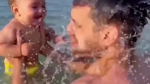 Baby laughing at the beach with dad #shorts #fyp #cute #viral
