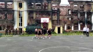 Kharkiv graduates dance in front of destroyed school
