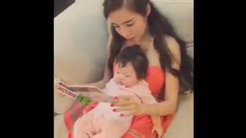 Elly Tran and Cadie reading book together