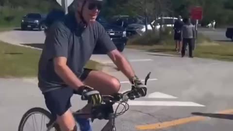 President Biden falling off her bicycle.