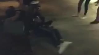 Guy jumping on friends and they all fall