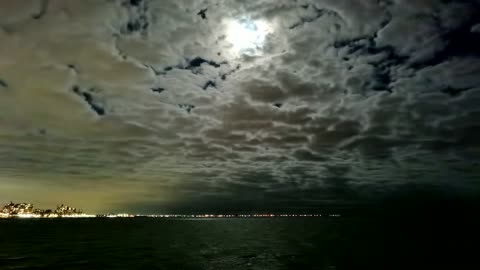 Creepy Time Lapse Video of the Full Moon Behind a Cloudy Erie Sky.