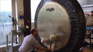 Gong Master Creates Eerie Music on Giant Gong