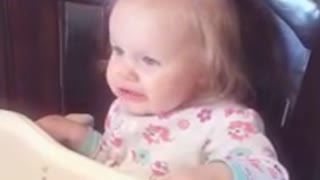 Baby has conflicting emotions after tasting orange juice