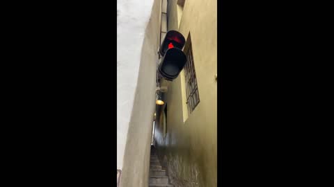 Tiny one-way stairway in Prague requires traffic light for pedestrians
