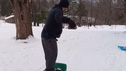 Snow boarding on a sled