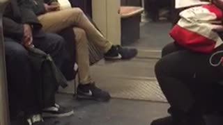 Lady dances by herself in a subway train