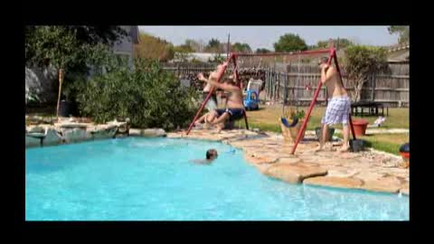 Swinging Dad Caught In An Awkward Pool Stunt