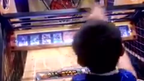Kid Demonstrates Killer Skills At Arcade Basketball Hoops