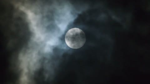 Full Moon Slowly Being Covered by Clouds