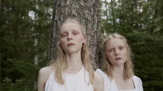 Women Standing Near the Tree