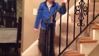 Kid Walks Around House Singing With A Diaper On His Head