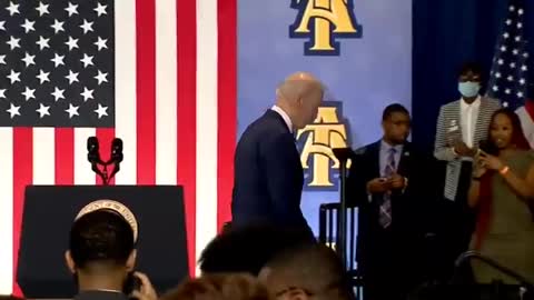 Biden ends speech by handshaking air, ‘talking to flag behind him’