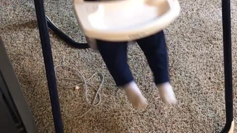 Baby swings on baby booster seat and hits head on rail