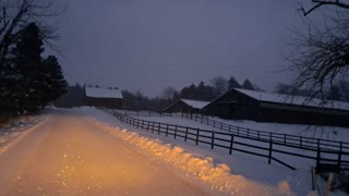Farm in the snow at night