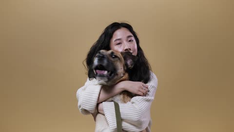 A Couple Playing with Their Dog