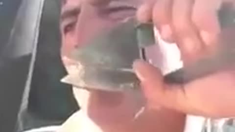 Lorry driver cutting his mustache with a clipper