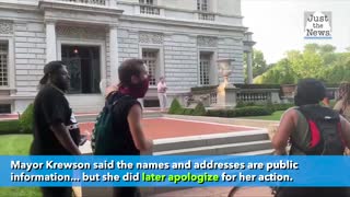 Man and woman point guns at St. Louis Protesters