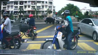 Car Flips Motorcyclist Off Bike at Intersection