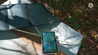 Charging my devices using my solar charger 🌞