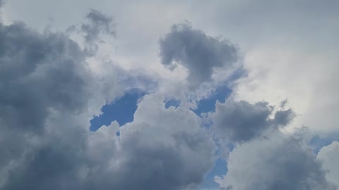 Blue skies above storm could