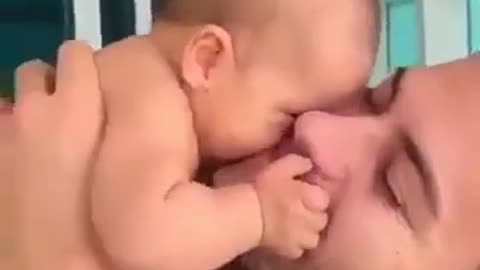The most beautiful child in the world plays with his father.