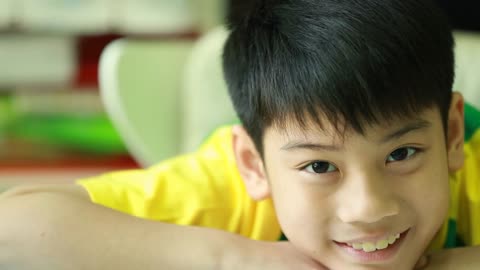 young asian boy and emotions portrait of happy kid looking at camera Children