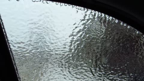 Ice storm. Smashing the car window.