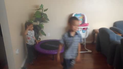 boy demonstrates comically how to use an exercise ball