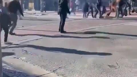 Bystanders try to help a man that's on fire