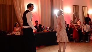 Groom and his mom pull off awesome mashup dance
