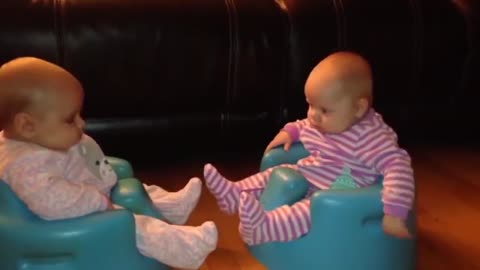 cute baby laughing talking to each other