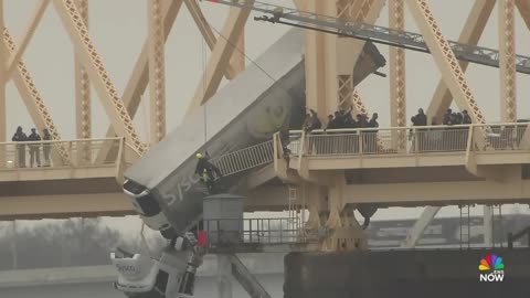 Louisville firefighters rescue driver from truck dangling off bridge