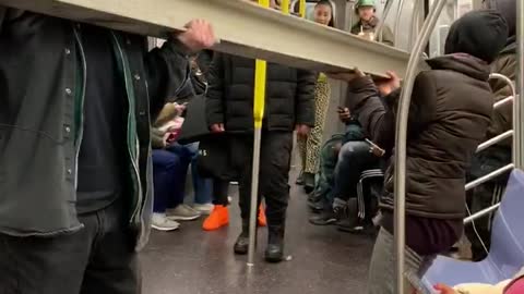 Pt. 2 guy carries gray metal beam inside subway train
