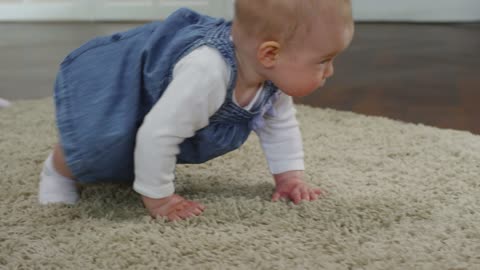 Baby Girl Crawling On The Floor