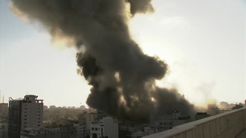 A Journalist reports live from Gaza as neighbouring building hit by Israel airstrike