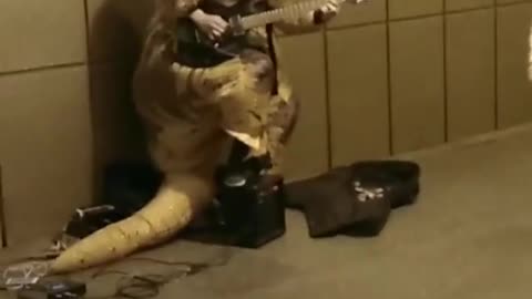 Trex subway playing guitar