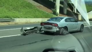 Bumper Hangs Off Car on Highway