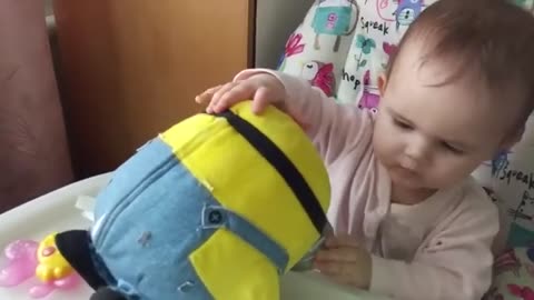 Exciting_introduction_of_a_cute_baby_with_a_new_minion_toy!